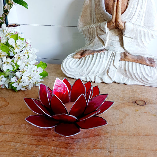 The Lotus Flower is a symbol of achieving enlightenment, peacefulness and spirituality. This beautiful candle holder can be fitted with tealight candles or slightly larger candles. The diameter of the middle is roughly 5.5cm, so it will fit any candle with the same diameter.