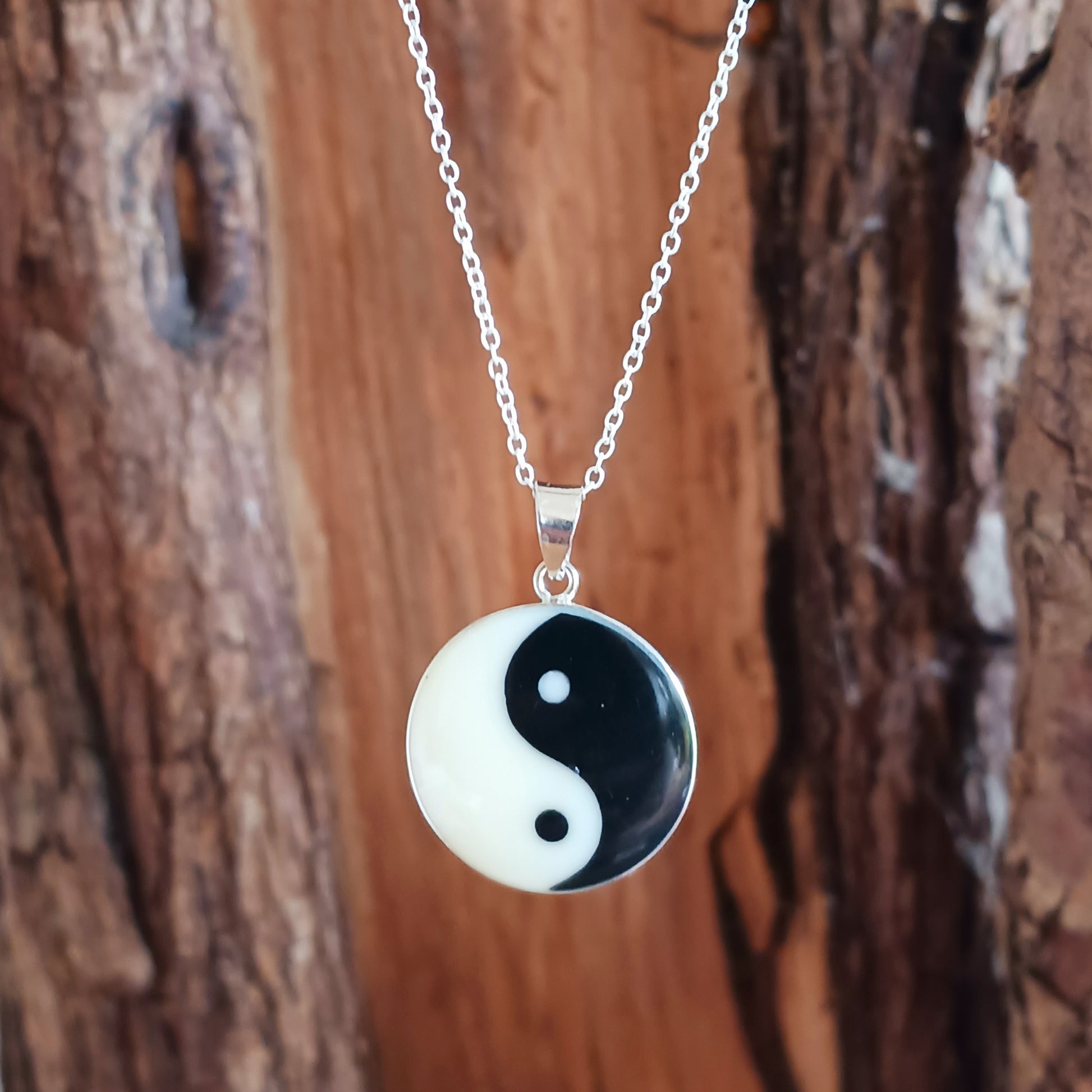 This sterling silver Yin Yang pendant on a silver chain is intended to balance the mind.  Handcrafted for durability and designed to last a lifetime.