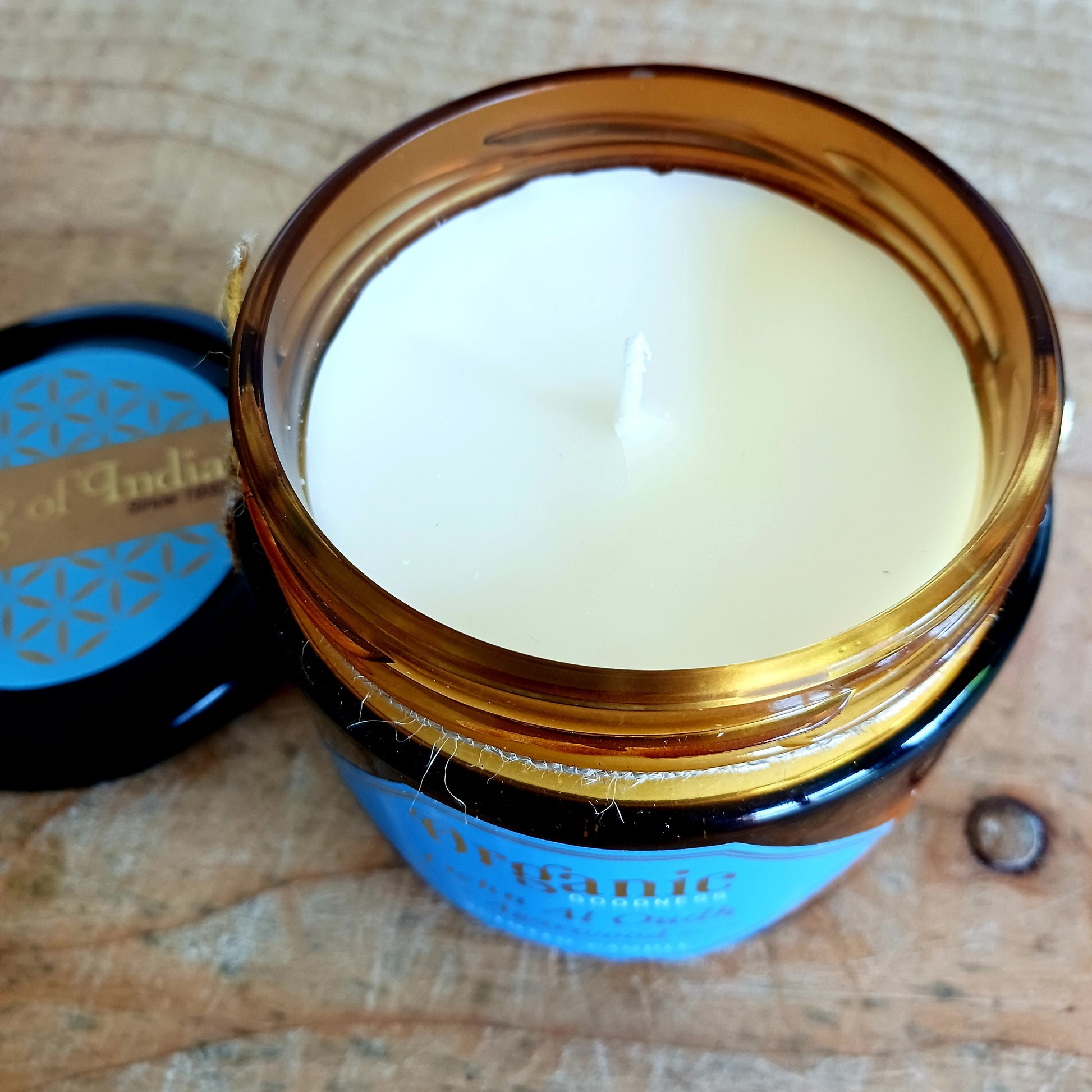 Organic Goodness candle scented with Agarwood and Oud essential oils creating a warm and inviting woody scent.