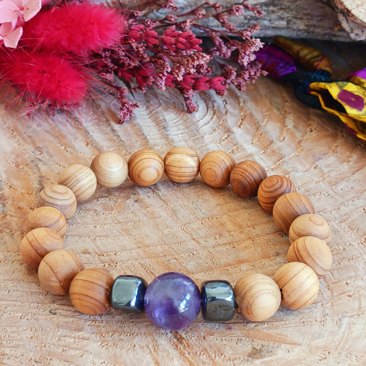 Embark on a journey of inner growth, intuition, and spiritual clarity with the Cedarwood Third Eye Chakra Bangle featuring Amethyst. This enchanting bracelet combines the grounding energy of natural cedarwood with the transcendent vibration of amethyst, a stone renowned for awakening the Third Eye Chakra and enhancing spiritual awareness.
