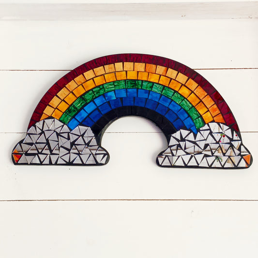 Bring colour, light, and personality into your home with the Mosaic Rainbow Wall Mirror Plaque. Featuring a vibrant rainbow-inspired mosaic design with a reflective mirror centre, this decorative wall plaque adds a cheerful touch to bedrooms, nurseries, playrooms, living spaces, or hallways.