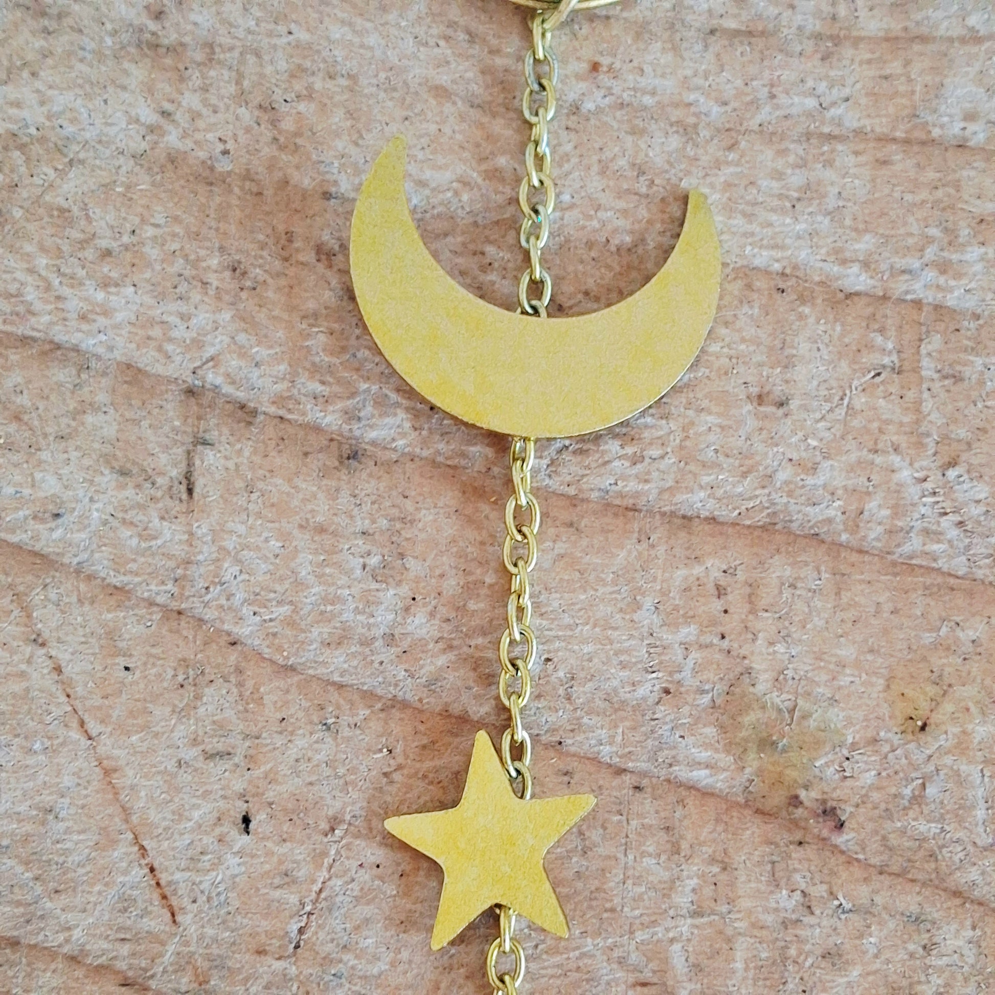 Add a touch of sunshine to the home with this summer bee suncatcher. This charming suncatcher features a beautifully detailed bee, star and crescent moon design made from metal and resin. Hang it in the window to catch the light and bring a cheerful, colourful glow to any room.