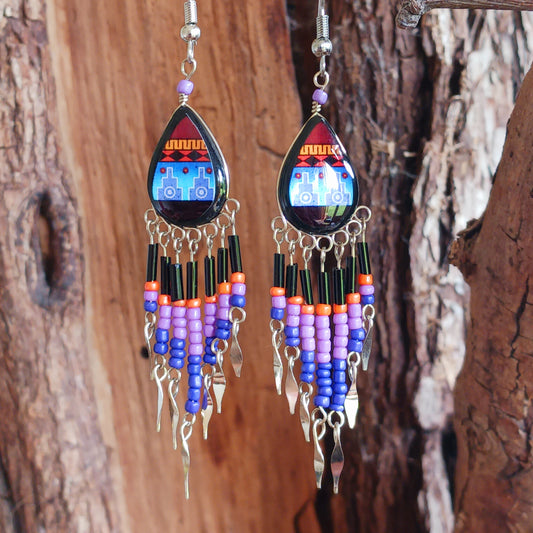 Add a touch of artisan elegance to your jewellery collection with these stunning handmade Peruvian Incan teardrop earrings. Carefully crafted in small family-run workshops in Peru, these eye-catching earrings feature traditional Incan-inspired patterns on the front with a contrasting black reverse for a striking finish.