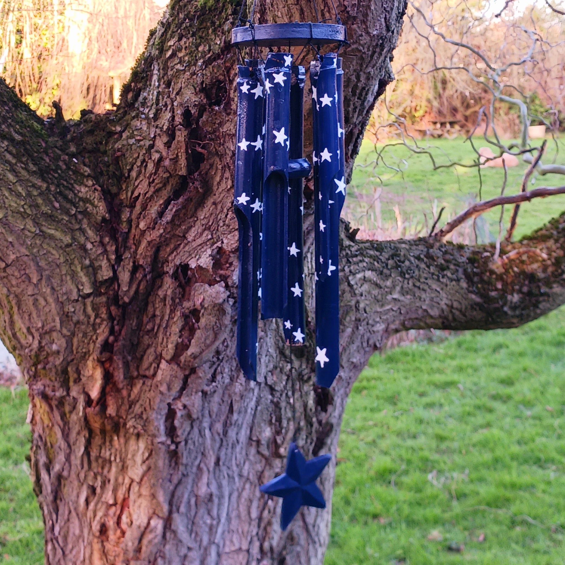 This great sounding bamboo windchime is perfect for hanging in a tree or from a wall in your garden, or even in your bedroom! This windchime has been hand painted in a calming night sky design - bringing calm to whichever place you hang it.