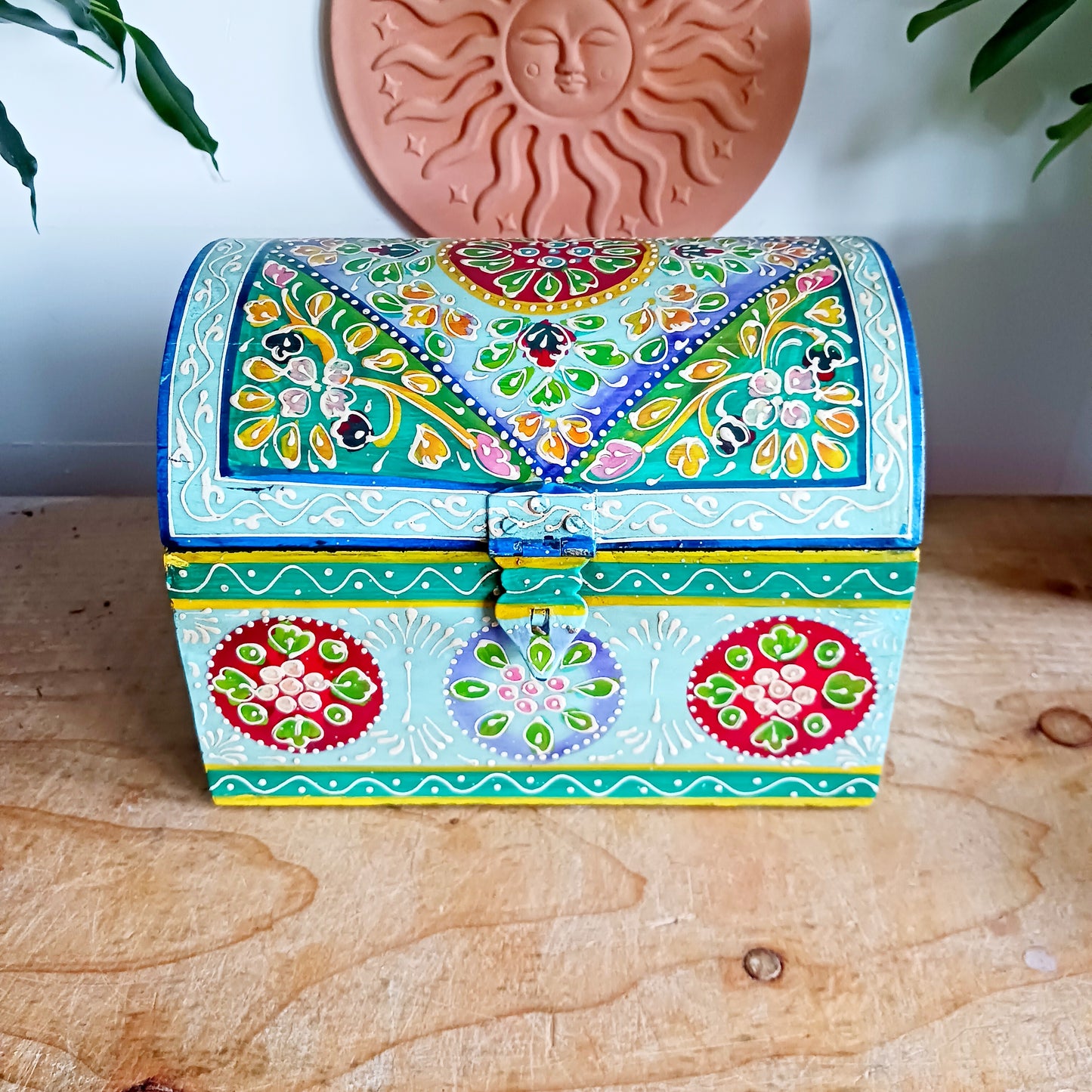 Add a touch of artisan charm to your home with this beautiful handmade and hand-painted domed wooden box, featuring a striking turquoise floral pattern. Carefully crafted in India, each piece showcases traditional craftsmanship and vibrant detailing, making every box truly unique.