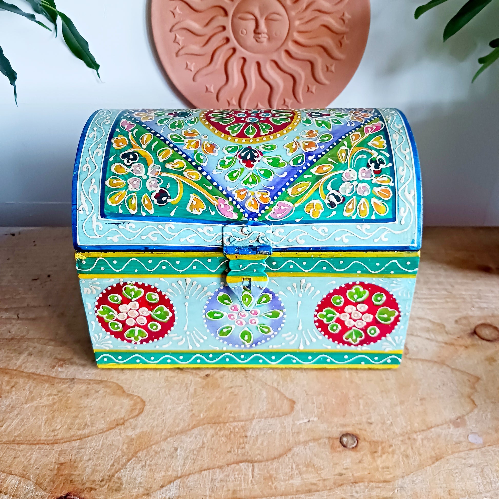 Add a touch of artisan charm to your home with this beautiful handmade and hand-painted domed wooden box, featuring a striking turquoise floral pattern. Carefully crafted in India, each piece showcases traditional craftsmanship and vibrant detailing, making every box truly unique.