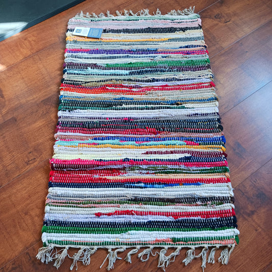 An Indian classic, this multi-coloured cotton and viscose striped rag rug is made from recycled materials and is machine-washable.