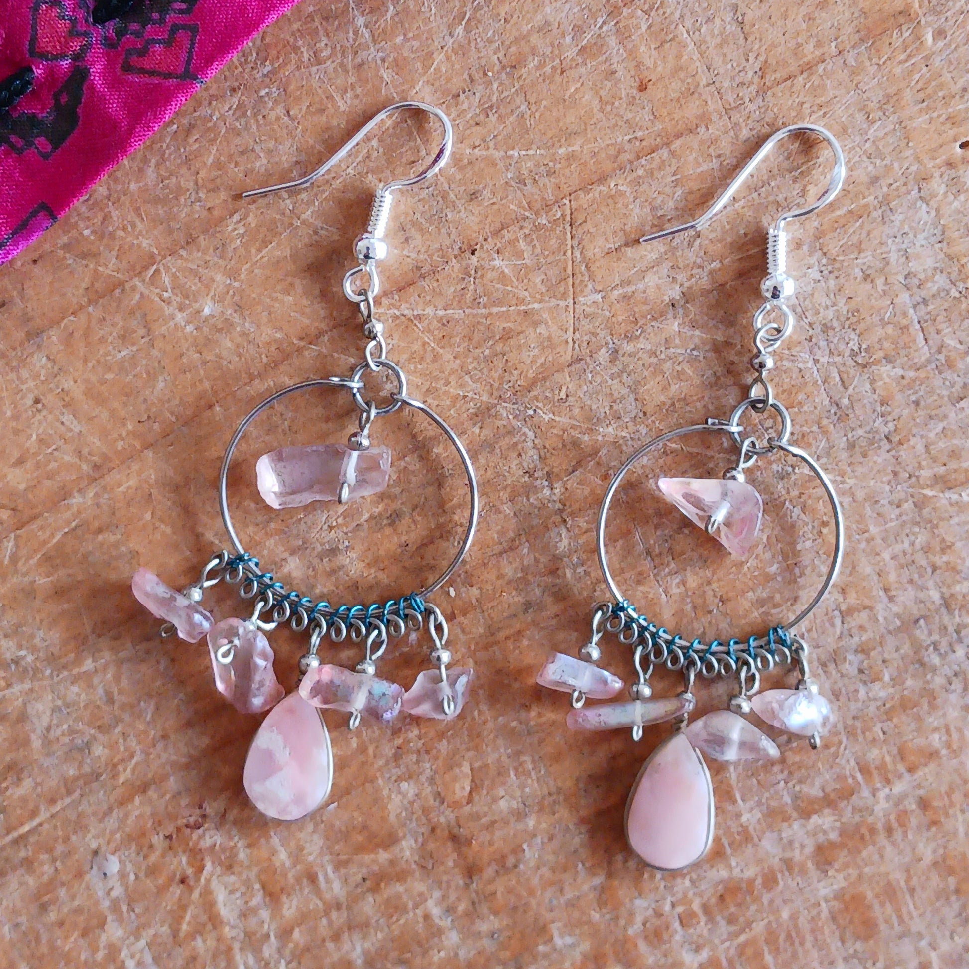 Add a touch of bohemian beauty to your look with these handmade Peruvian stone earrings. Featuring rose quartz stones and finished with silver-plated hooks, each pair is carefully crafted in small workshops in Peru.