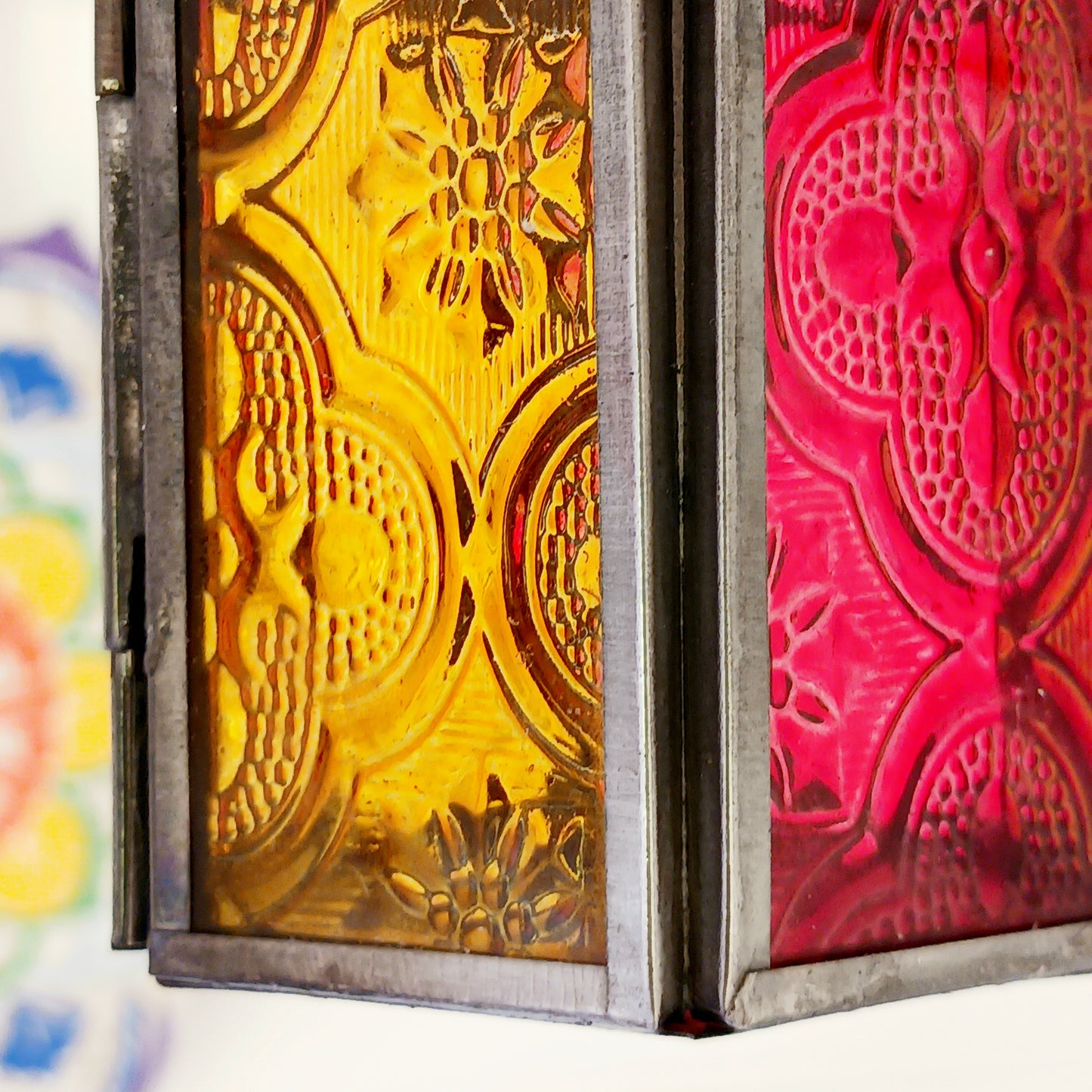 These small glass lanterns come in wonderful colours, featuring an intricate embossed pattern. They have a small hinged door that closes with a sliding catch. The small handle on the top is great for hanging the lanterns around your home. Perfect for adding a touch of warmth to your space.