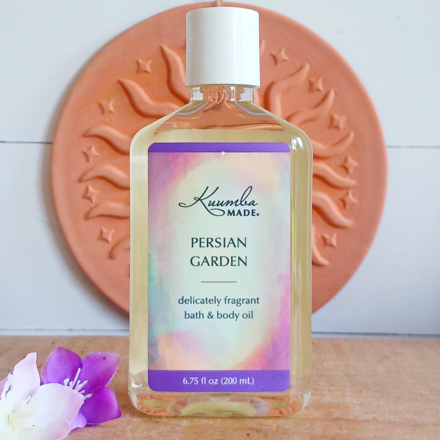 Grounded, smooth, very light and clean with a hint of mystery. A garden of earthly delights, this fast absorbing Persian Garden versatile Bath and Body Oil is packed with moisturizing agents that leave skin and hair radiant, healthy and softly aromatic. Use for daily moisturizing, a lavish massage, a nourishing bath, and as a deep conditioning hair treatment. Made with organic ingredients.