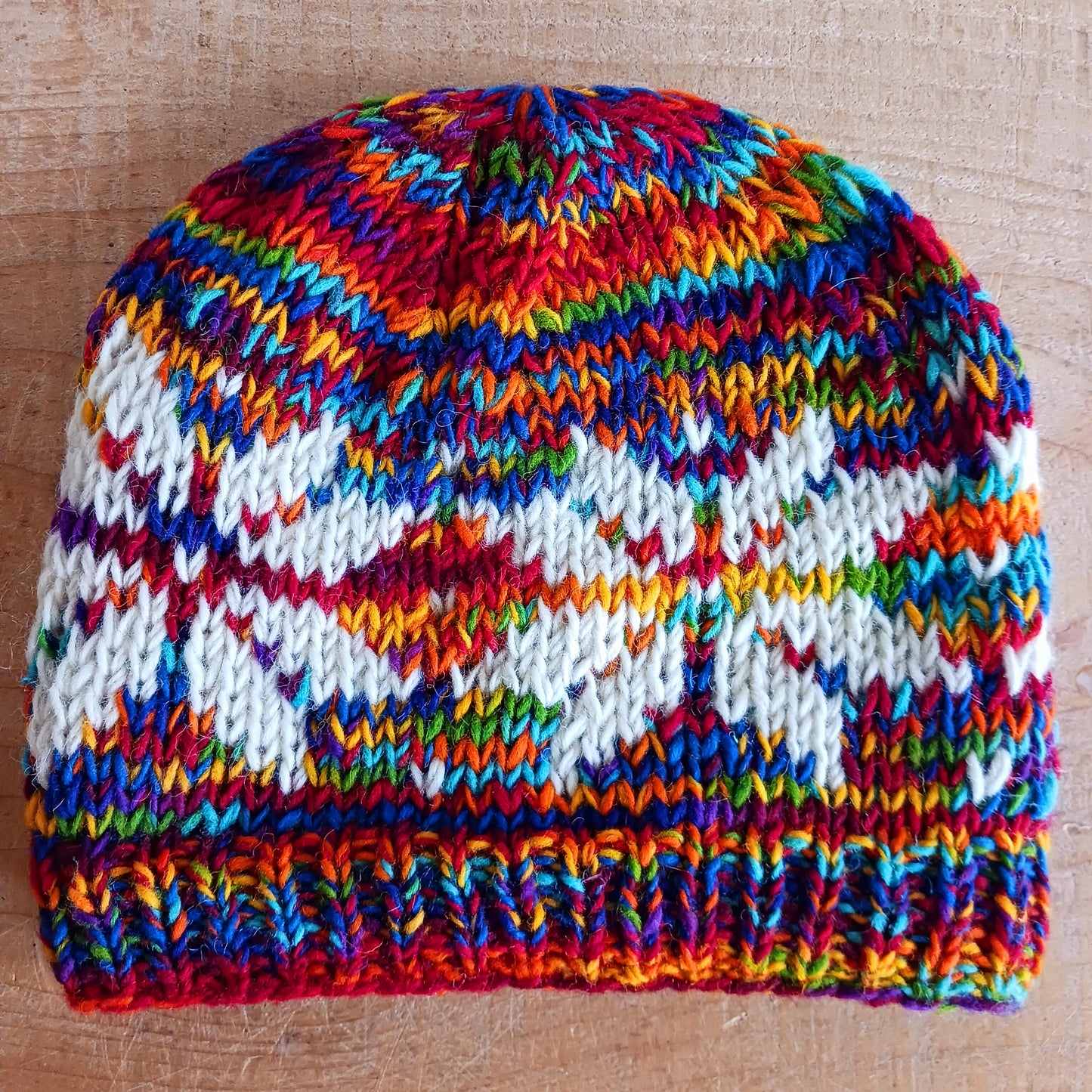Chunky wool beanie hats hand made in Nepal with fleece lining for extra warmth and comfort, this handmade hat is awesomely warm. These knitted beanie hats have a rolled brim, a warm lined interior and are available in mixed colours.