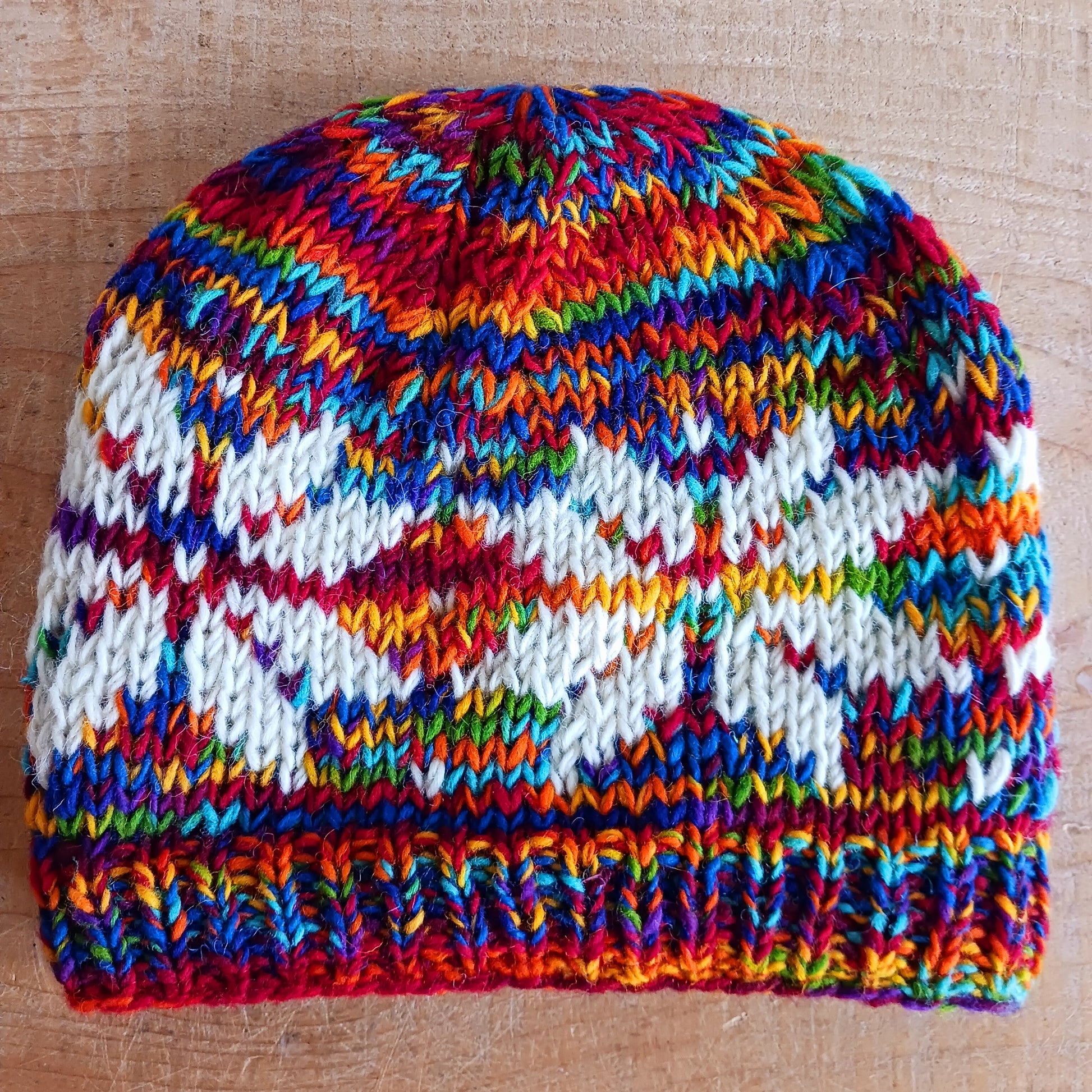 Chunky wool beanie hats hand made in Nepal with fleece lining for extra warmth and comfort, this handmade hat is awesomely warm. These knitted beanie hats have a rolled brim, a warm lined interior and are available in mixed colours.