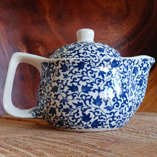 Add timeless elegance to any tea ritual with this Small Herbal Teapot featuring a stunning blue pattern design. Inspired by traditional Eastern aesthetics, this beautifully crafted teapot blends cultural symbolism with everyday functionality, making it an exceptional gift.