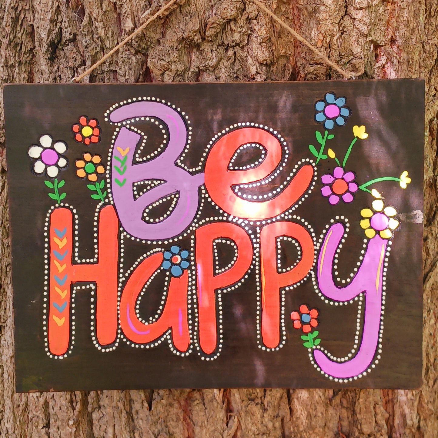 Bring joy and positivity into your home with this handmade “Be Happy” Wall Plaque. Expertly crafted and finished by skilled artisans in Indonesia, this vibrant piece features a bold floral design surrounding the uplifting words “Be Happy.” Each plaque is unique, reflecting the natural textures and craftsmanship of traditional artistry.
