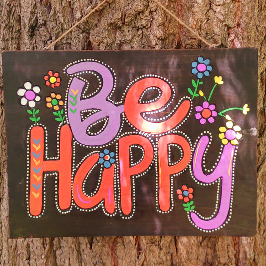 Bring joy and positivity into your home with this handmade “Be Happy” Wall Plaque. Expertly crafted and finished by skilled artisans in Indonesia, this vibrant piece features a bold floral design surrounding the uplifting words “Be Happy.” Each plaque is unique, reflecting the natural textures and craftsmanship of traditional artistry.