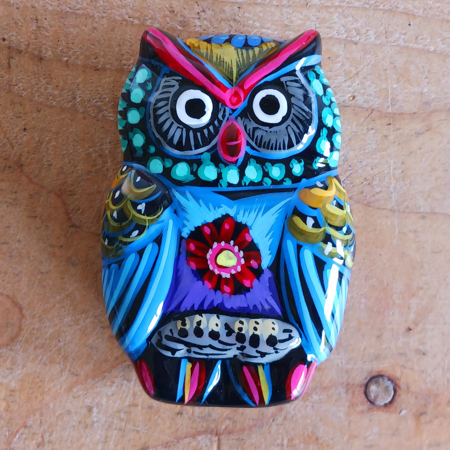 Bring a burst of colour and culture into your home with this beautifully hand-painted owl trinket pot, a unique piece that blends functionality with traditional artistry.