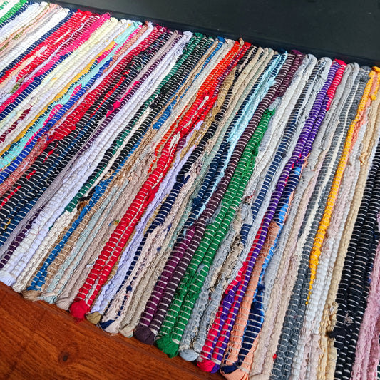 An Indian classic, this multi-coloured cotton and viscose striped rag rug is made from recycled materials and is machine-washable.