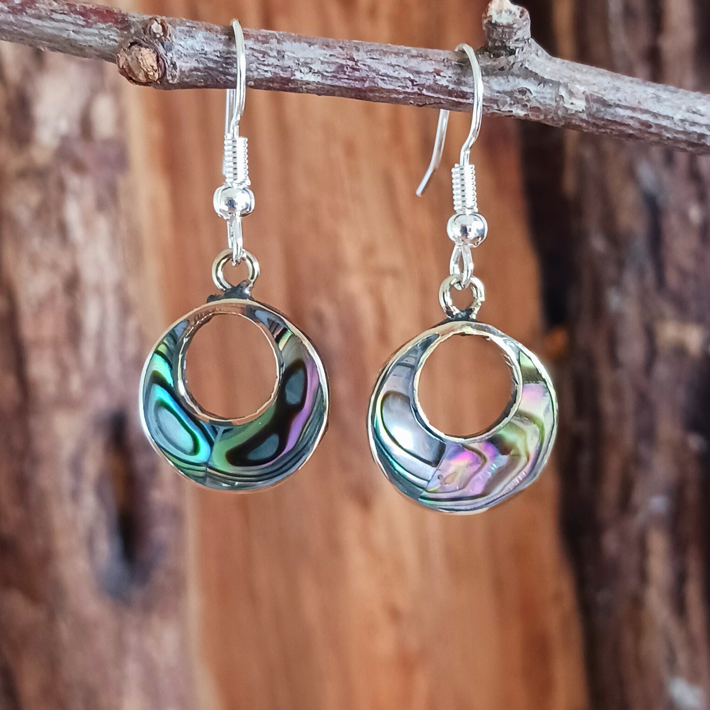 Rock the 'jefa' ('girl boss') look with these small but stylish hoop earrings crafted from iridescent abalone shell.