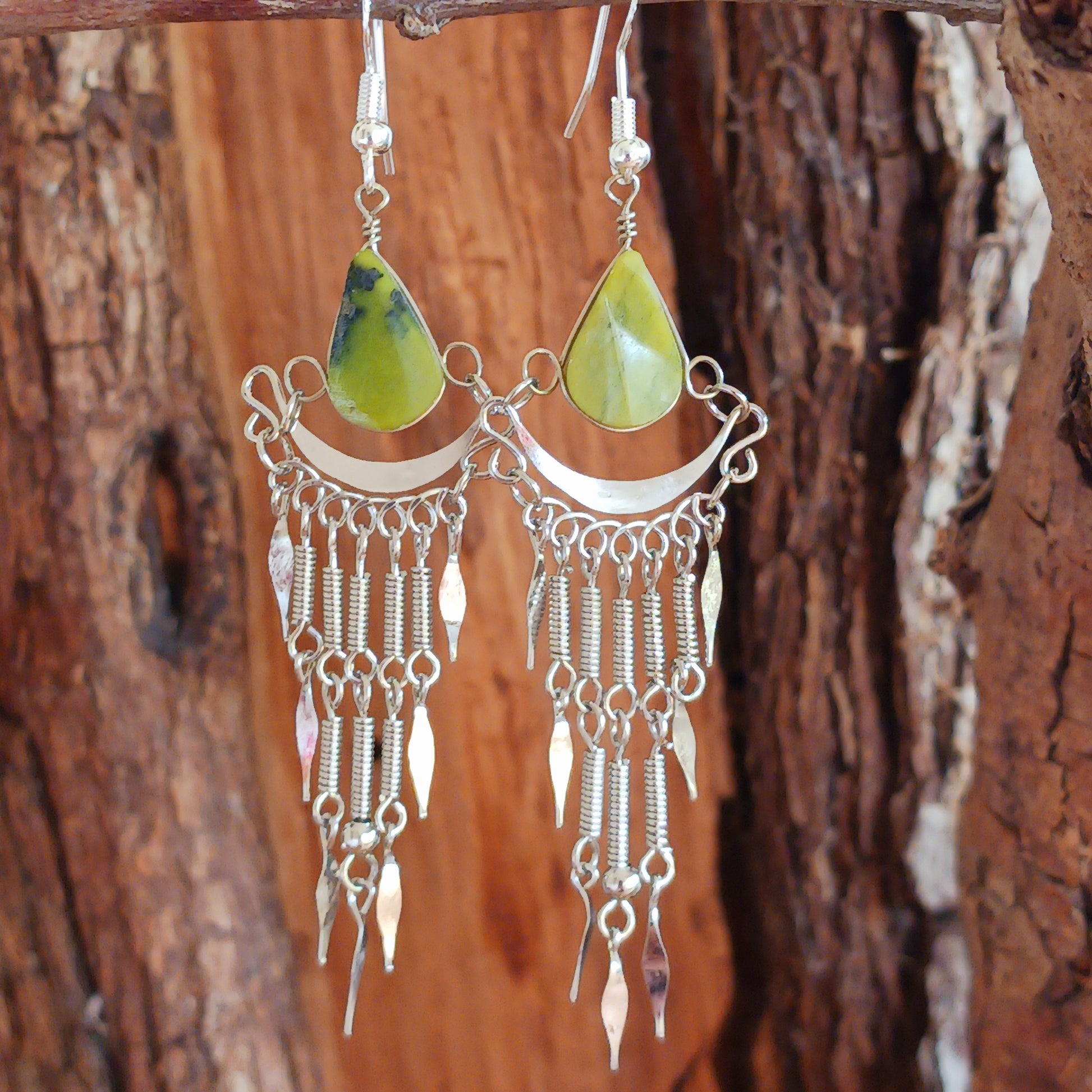 Add a touch of bohemian beauty to your look with these handmade Peruvian stone earrings. Featuring green aventurine stones and finished with silver-plated hooks, each pair is carefully crafted in small workshops in Peru.