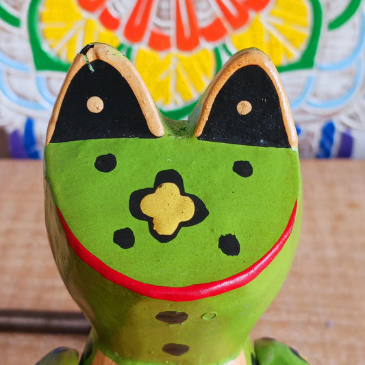 Add charm and whimsy to any space with this adorable hand-carved wooden frog! Perched on a swing and suspended by a long spring, this frog bounces gently in the air, bringing playful motion and joy to any room. Each piece is carefully hand-painted and carved from fast-growing, sustainably harvested albesia wood, making it a more eco-friendly choice for softwood décor. Whether for a nursery, porch, or creative space, this eye-catching novelty is sure to delight kids and adults alike!