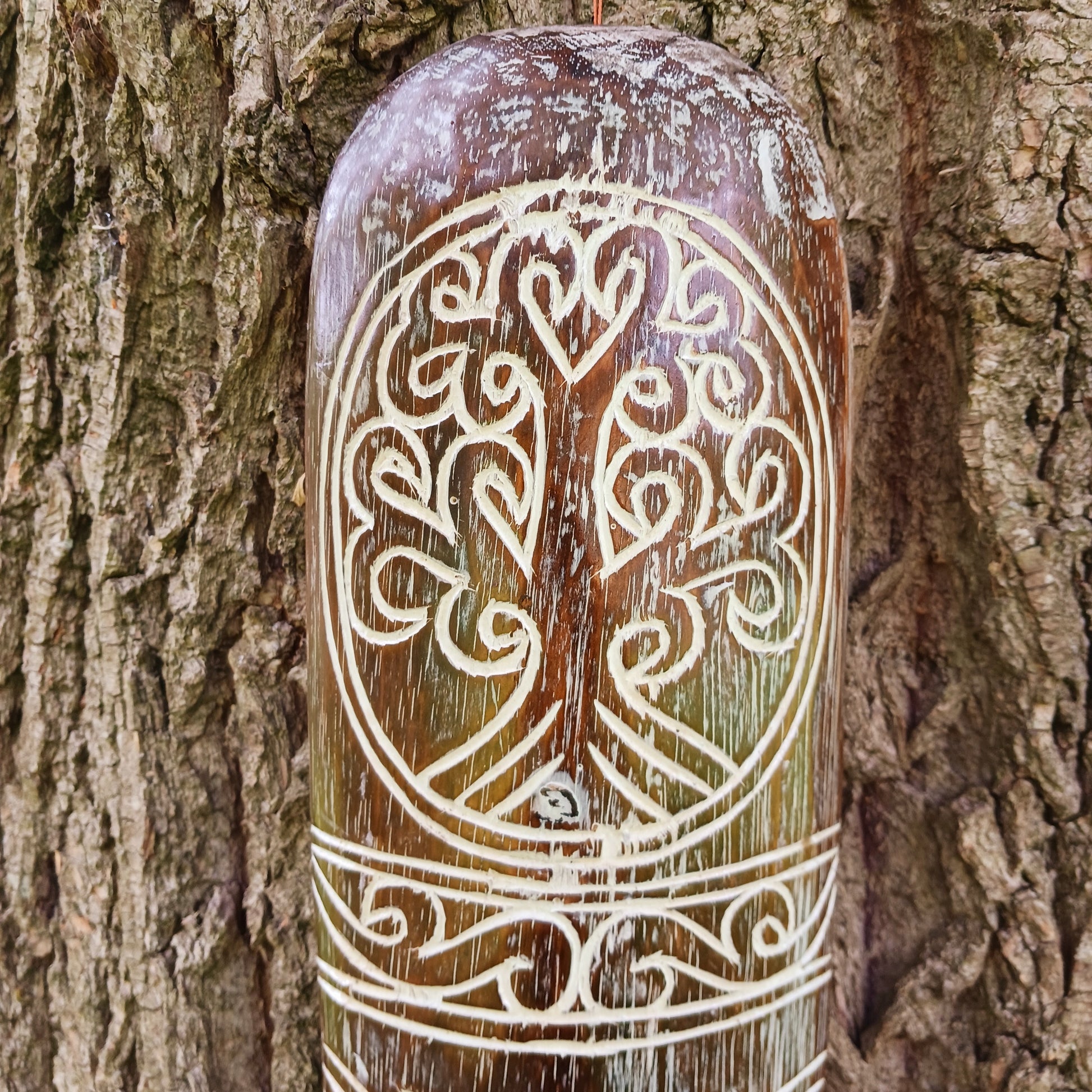 Bring the spirit of Celtic heritage into your home with this beautifully hand-carved Celtic wooden mask, featuring intricate knotwork and a Tree of Life pattern that symbolize eternity, unity, and tradition. Designed for lovers of cultural art and meaningful decor, this striking wall piece adds depth, character, and history to any space.