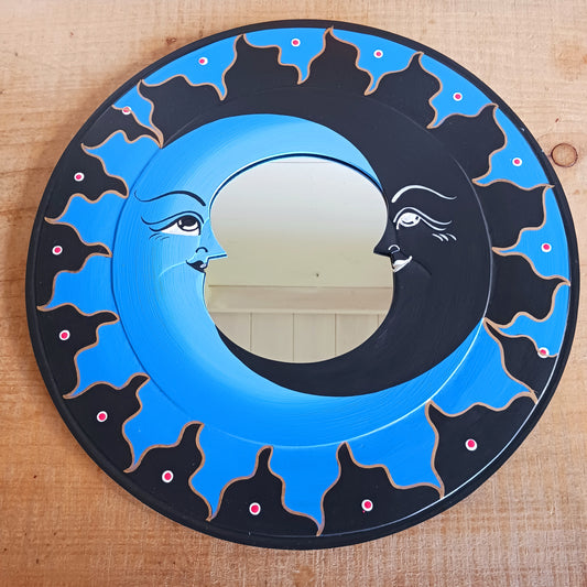Transform your space with the enchanting Dark &amp; Light Moon Mirror. Designed with a striking dark blue and black painted wooden frame, this mirror blends whimsy and mystery to create an eye-catching focal point in any room. Perfect for adding a dreamy, celestial vibe, it reflects light beautifully while inspiring imagination and creativity.