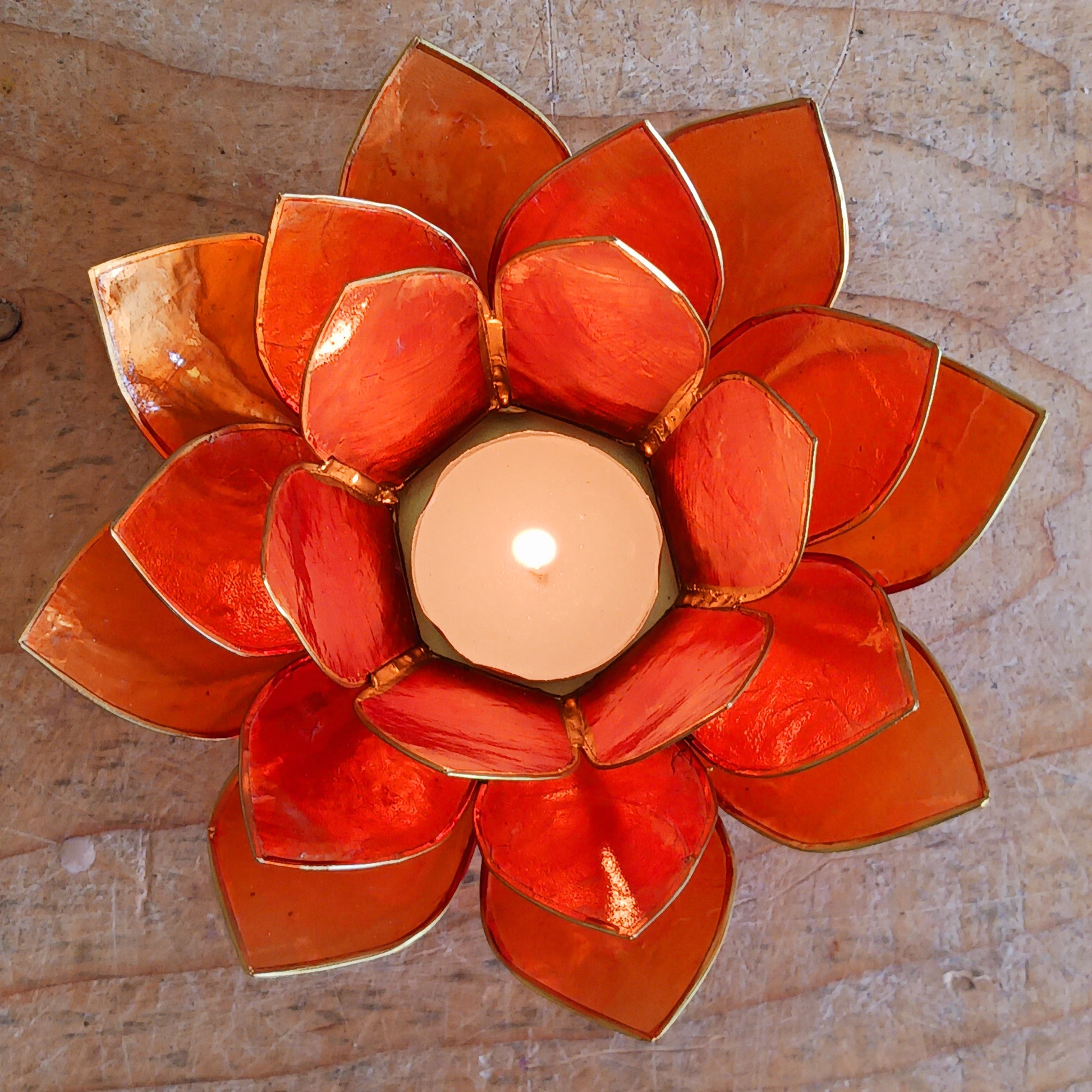 The Lotus Flower is a symbol of achieving enlightenment, peacefulness and spirituality. This beautiful candle holder can be fitted with tealight candles or slightly larger candles. The diameter of the middle is roughly 5.5cm, so it will fit any candle with the same diameter.
