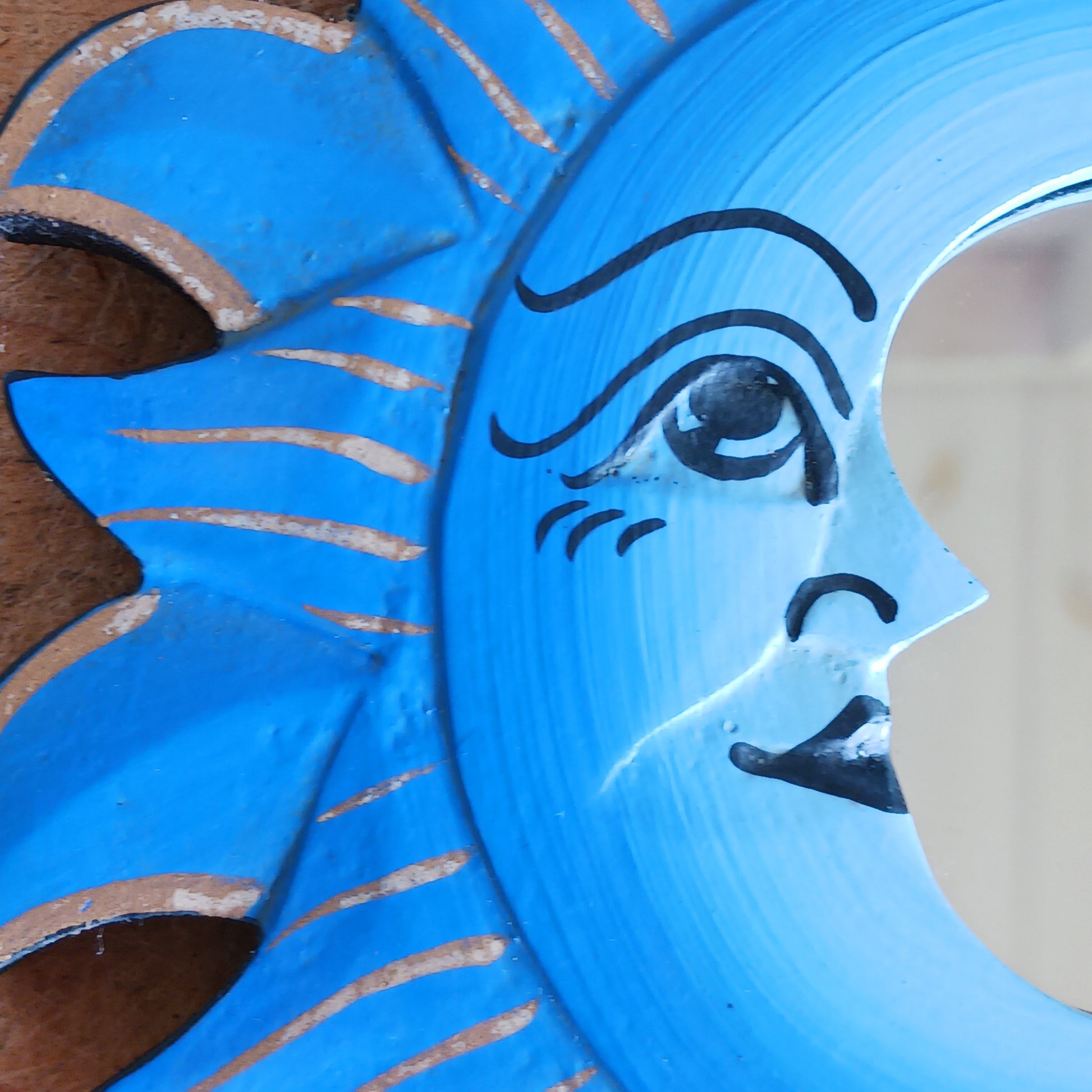 Elevate your home with our Little Sun &amp; Moon Mirror, a mystical and spiritual accent handmade by fairtrade artisans. Featuring an enchanting sun and moon design, this unique piece brings positive energy, balance, and harmony into any space. Perfect for adding a touch of celestial charm to your walls, this mirror doubles as meaningful décor and a symbol of light and reflection.