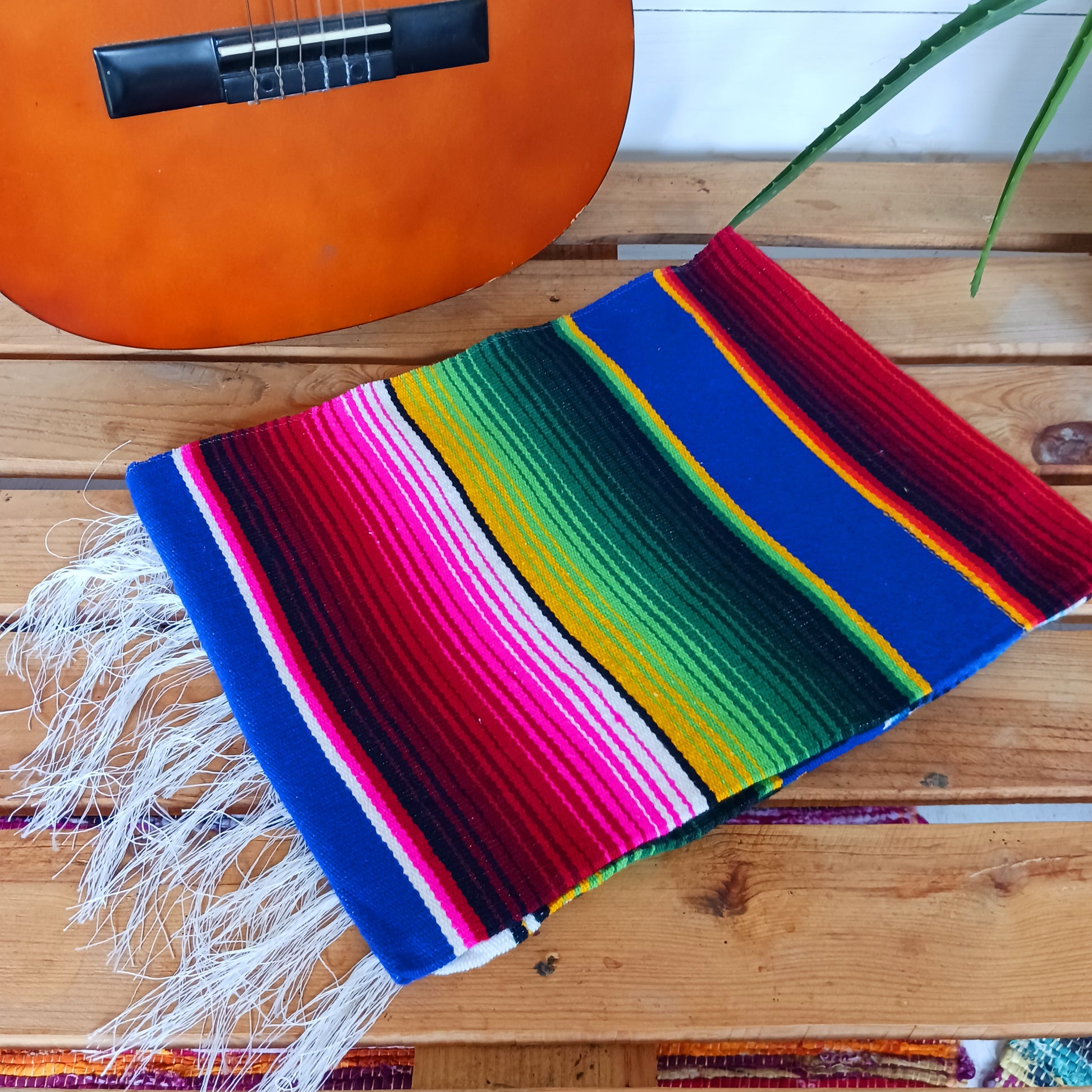 Bring bold colour and cultural charm into your space with our Mexican Serape Vibrant Blue Blanket. Inspired by traditional Mexican festival textiles, this eye-catching throw features striking tones and classic serape stripes that instantly brighten any room.