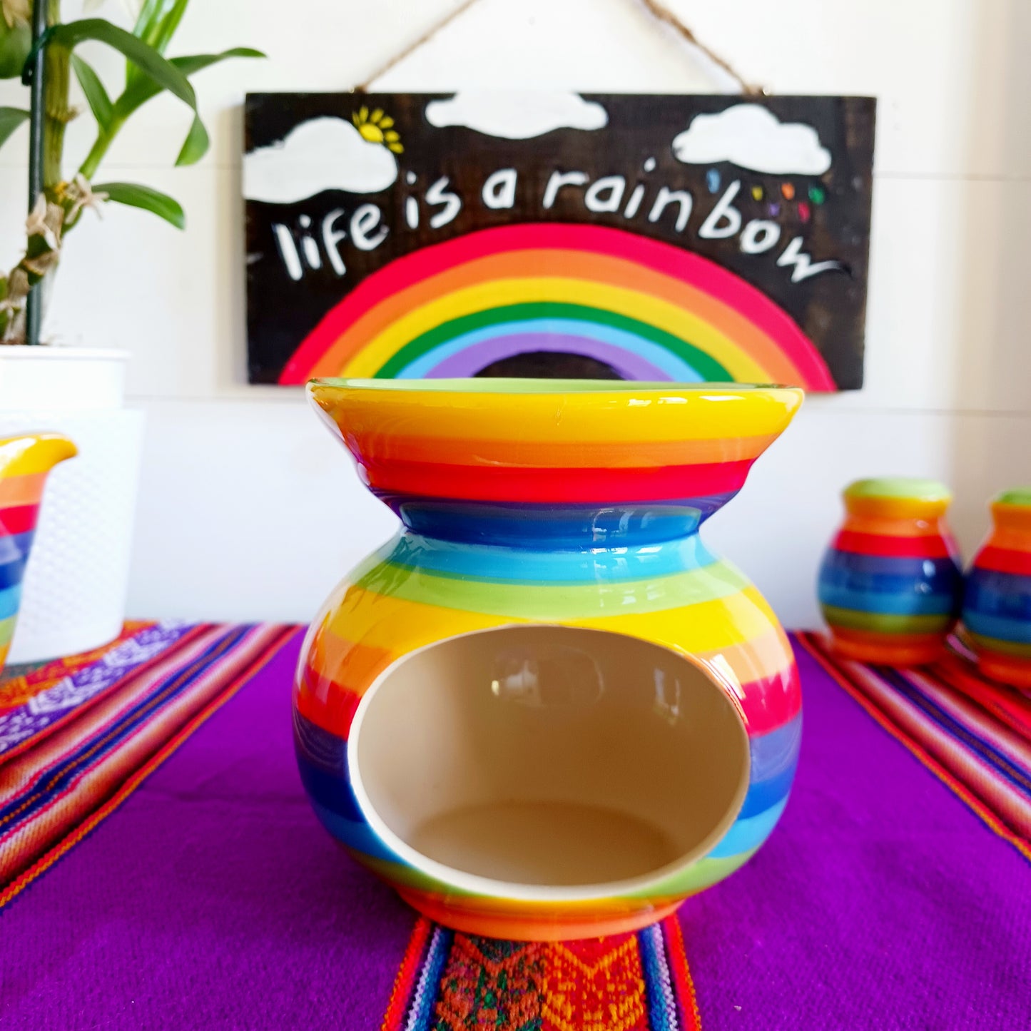 Wonderfully cheerful rainbow stripe ceramic oil burner. The vibrant stripes are hand painted giving each piece individual character.