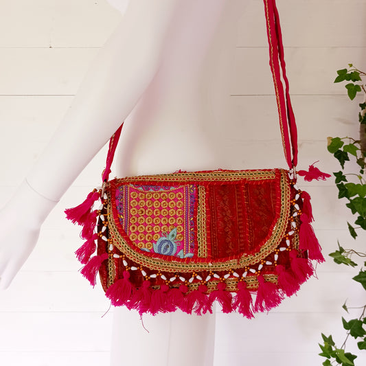 Add a vibrant touch to your everyday style with this beautifully handmade Indian embroidered handbag, crafted from upcycled materials for a truly sustainable fashion statement.