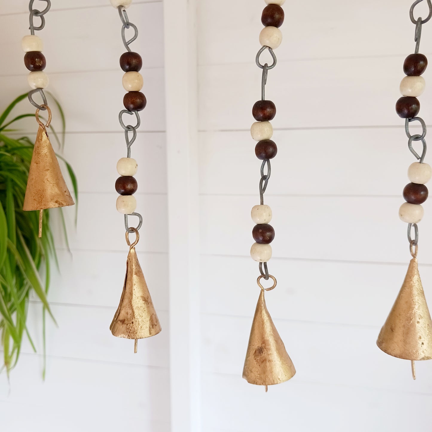 Bring the timeless symbolism of the Tree of Life to your home with this beautiful Tree of Life windchime.  Made in India from quality brass, this 25 cm chime features a beautifully detailed Tree of Life design, adorned with Indian beads. Each branch of the tree is a reminder of growth, connection, and harmony, while the soothing sounds of the bells offer peace to any space.