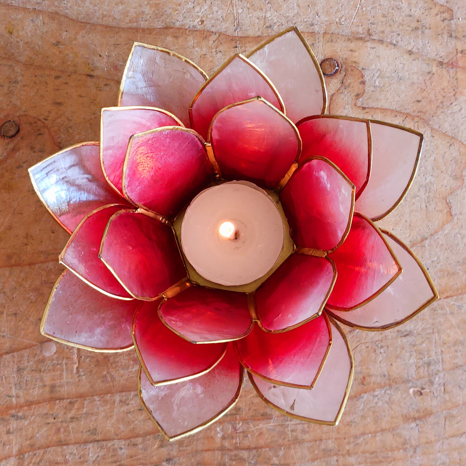 The Lotus Flower is a symbol of achieving enlightenment, peacefulness and spirituality. This beautiful candle holder can be fitted with tealight candles or slightly larger candles. The diameter of the middle is roughly 5.5cm, so it will fit any candle with the same diameter.