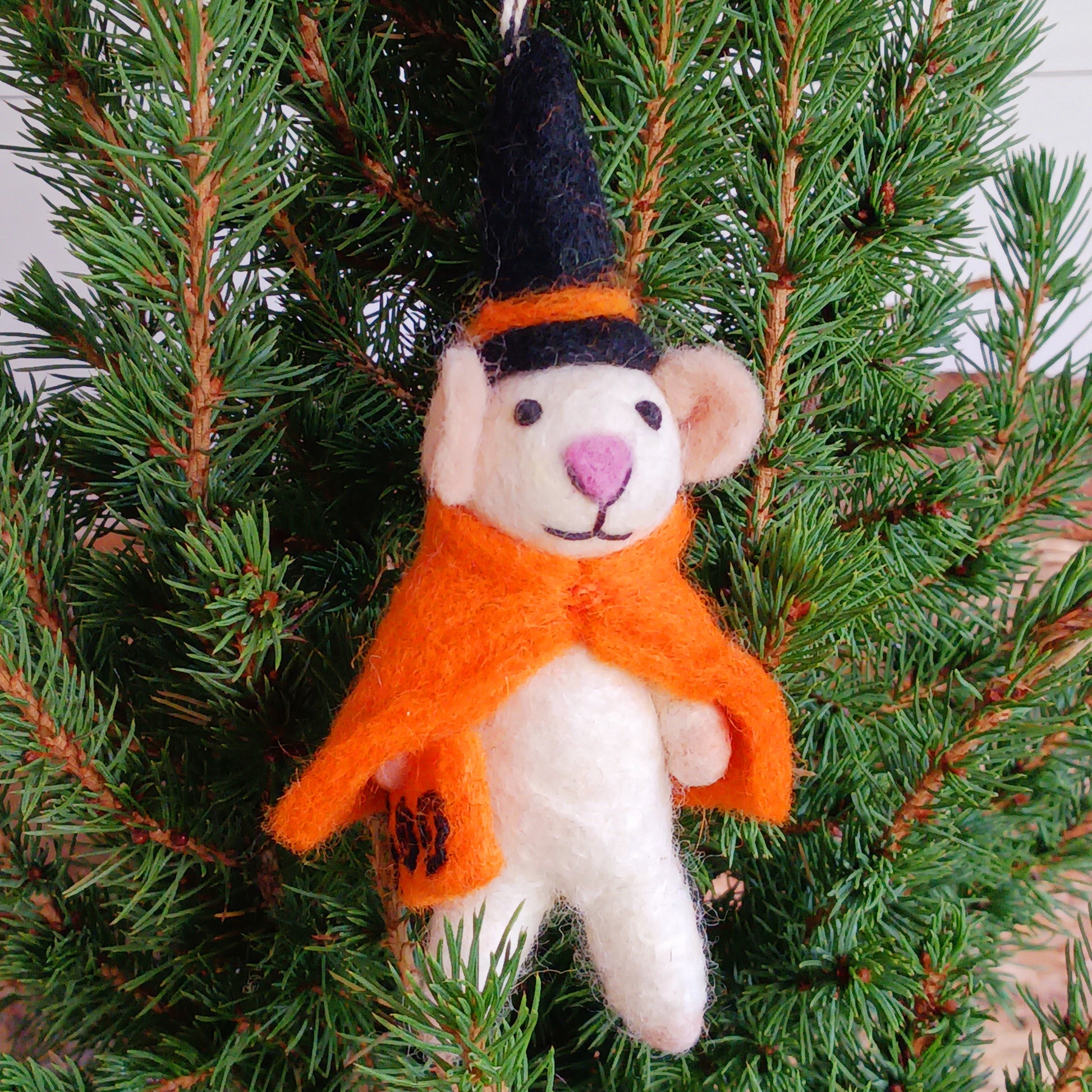 Bring a touch of handcrafted Halloween charm to your home with these delightful felted mice dressed as a playful “Boo” character. Each mouse features adorable details including long tails, soft pink ears and noses, and colourful pointed hats and capes. These little mice have a “Boo” sign—and comes with a black-and-white hanging thread, perfect for decorating branches, hooks, garlands, or spooky seasonal displays.