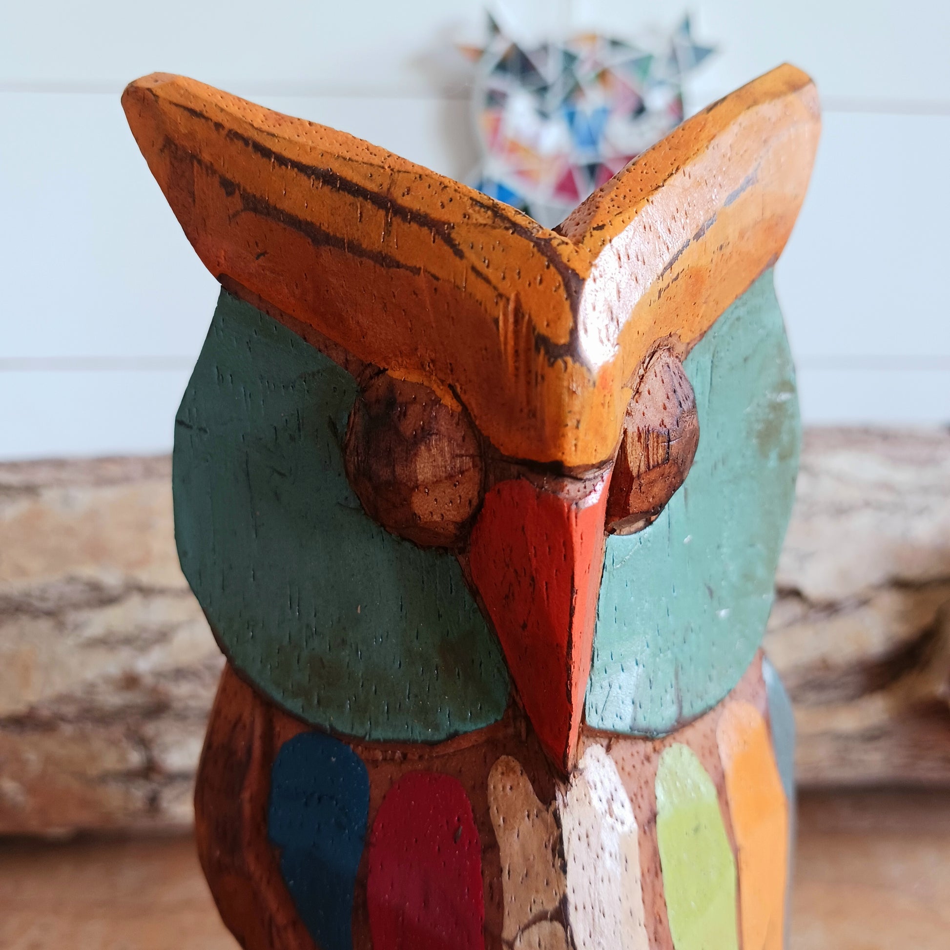 Bring a touch of nature and craftsmanship into your home with this beautifully hand-carved little wooden owl ornament. Carefully crafted from wood and finished in charming rustic colours, each owl is unique, showcasing the character and artistry of traditional woodcarving.