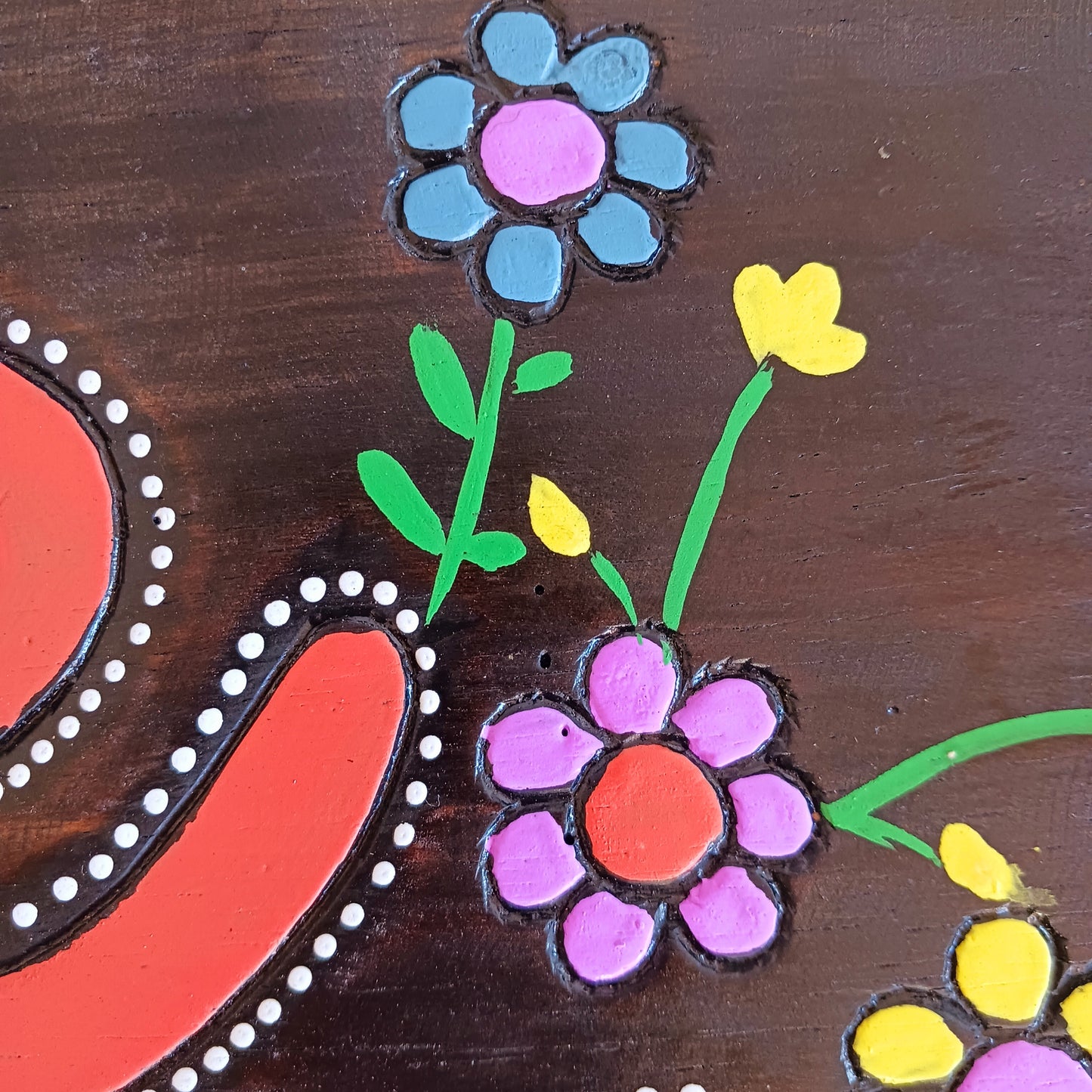 Bring joy and positivity into your home with this handmade “Be Happy” Wall Plaque. Expertly crafted and finished by skilled artisans in Indonesia, this vibrant piece features a bold floral design surrounding the uplifting words “Be Happy.” Each plaque is unique, reflecting the natural textures and craftsmanship of traditional artistry.