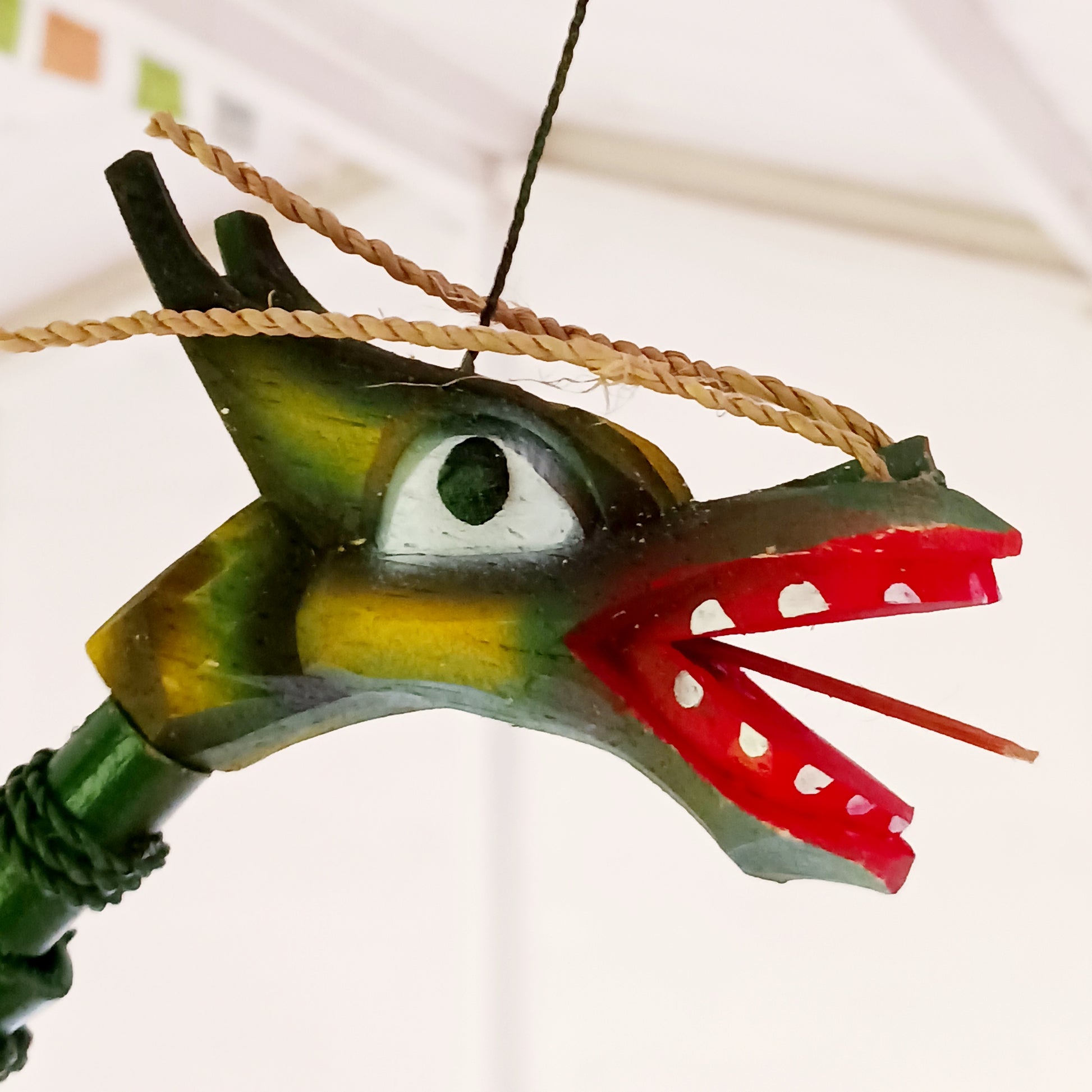 Bring a touch of magic and movement to your home or garden with this Large Green Coconut Dragon Mobile, a beautifully handcrafted decorative piece handmade in Indonesia.