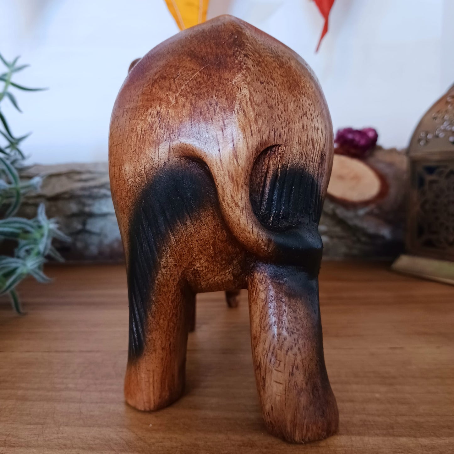 This beautiful wooden elephant ornament was hand carved acacia wood. This elephant will bring a cultural touch to room in your home. Elephants are not only beautifully awesome creatures, but they are respected symbols in many countries, representing wisdom, strength, protection and good luck.