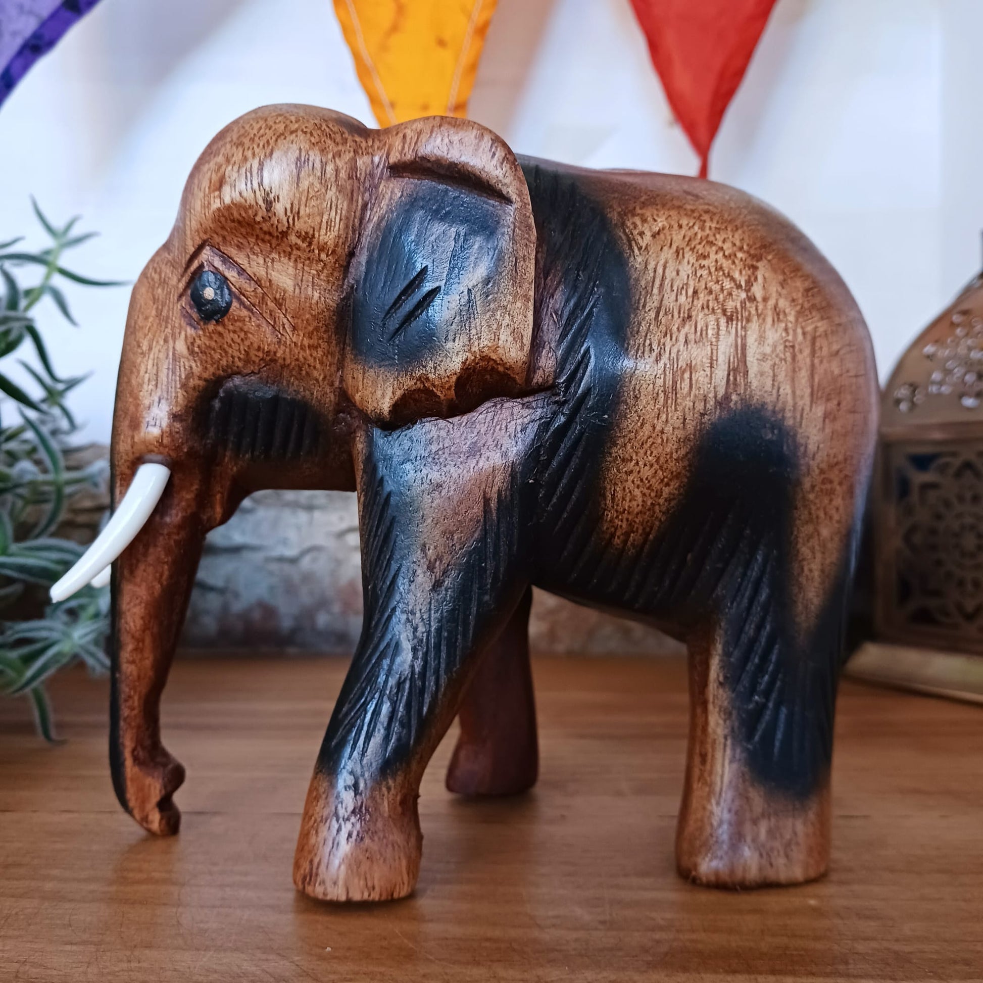 This beautiful wooden elephant ornament was hand carved acacia wood. This elephant will bring a cultural touch to room in your home. Elephants are not only beautifully awesome creatures, but they are respected symbols in many countries, representing wisdom, strength, protection and good luck.