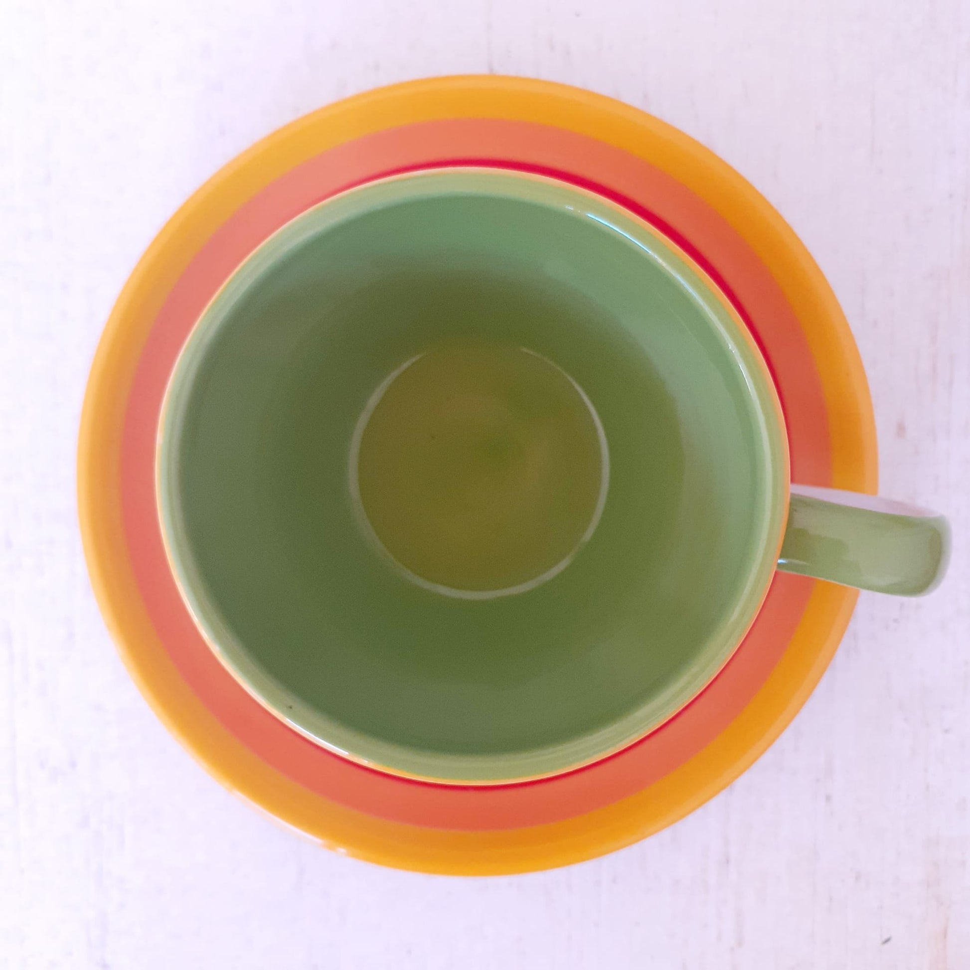 Hand painted rainbow coffee cup and saucer